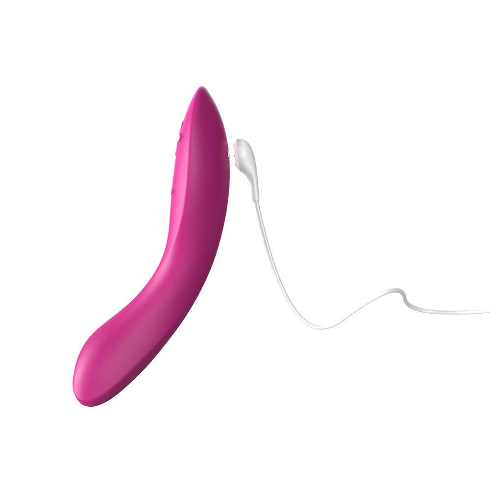 8 inch fuchsia g-spot vibrator with a magnetically rechargeable cord, showing how to charge the toy