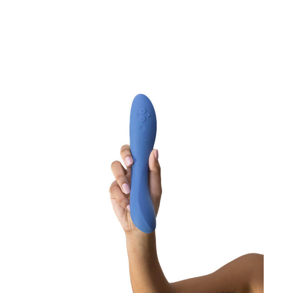 a brown manicured hand holds the we-vibe rave vibrator showing off the ridges and angles