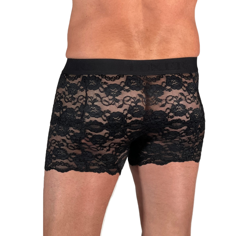 white male model in size medium faces away from camera to show off the see through lace men's lace boxers