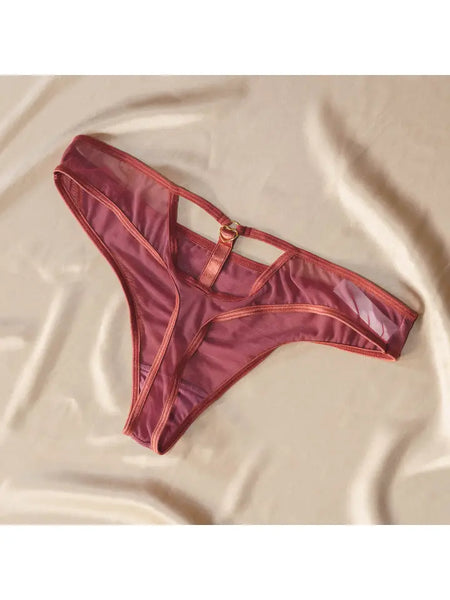 flat lay on cream fabric background of the Hearts of Venus Keyhole Thong in Copper Rose