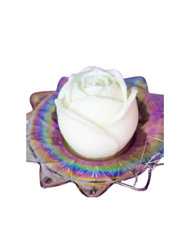 rose shaped white wax play candle on rainbow dish