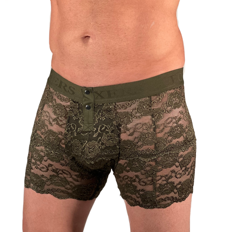 size small white model zoomed in on the torso/pelvis area. model is wearing olive green lace men's lingerie