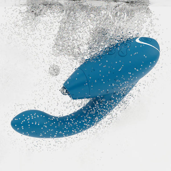 image shows the petrol blue womanizer 2 duo rabbit sex toy submerged underwater so show it's ipx7 feature