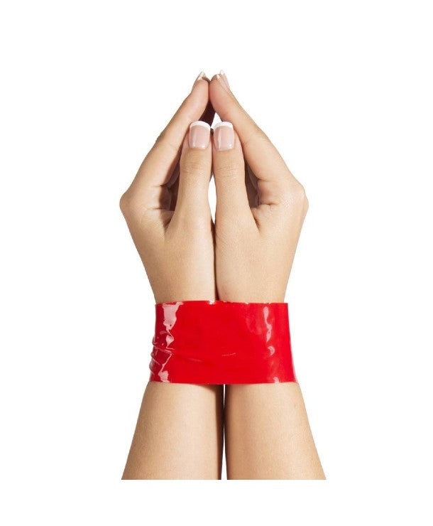 white feminine hands with red bondage tape wrapped around wrists